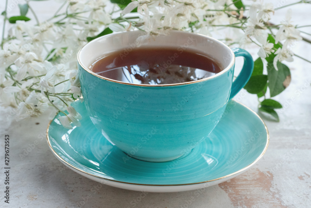 Cup of hot tea on a white wooden table background. Cup of hot tea on a white wooden table background.