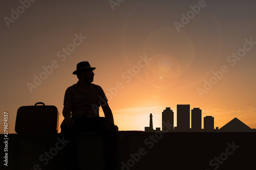 traveler in front of long beach city skyline in united states