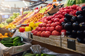 Vegetable farmer market counter: colorful various fresh organic healthy vegetables at grocery store. Healthy natural food concept