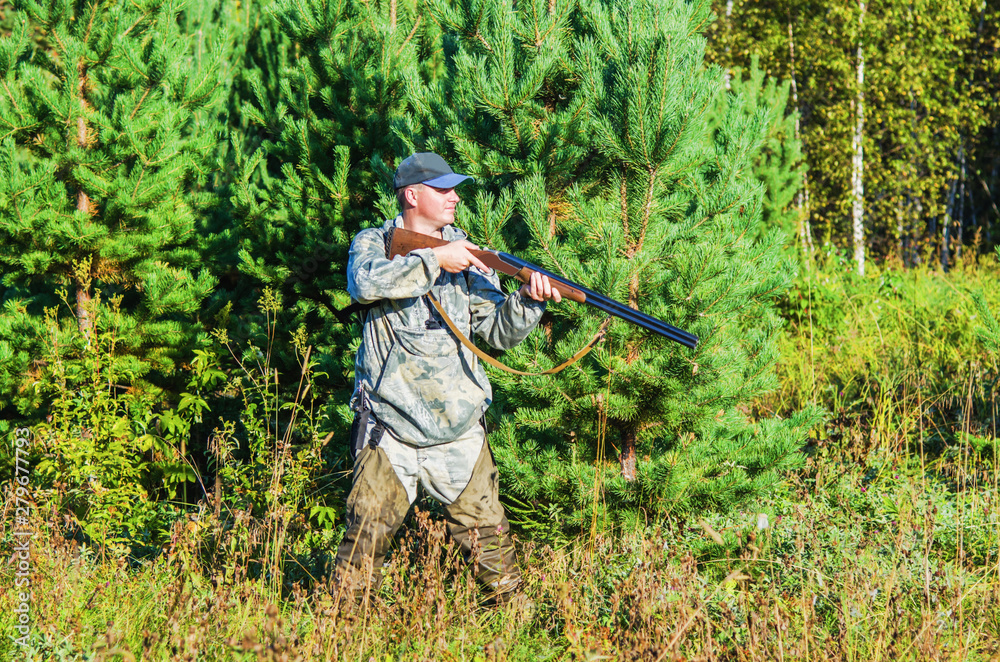 Hunter in the summer forest