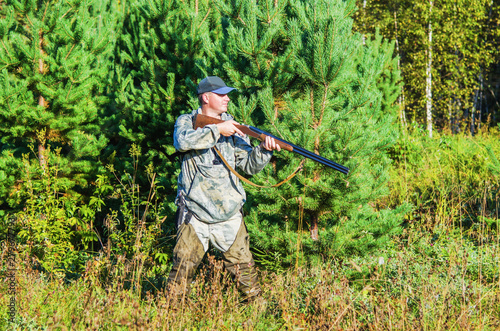 Hunter in the summer forest