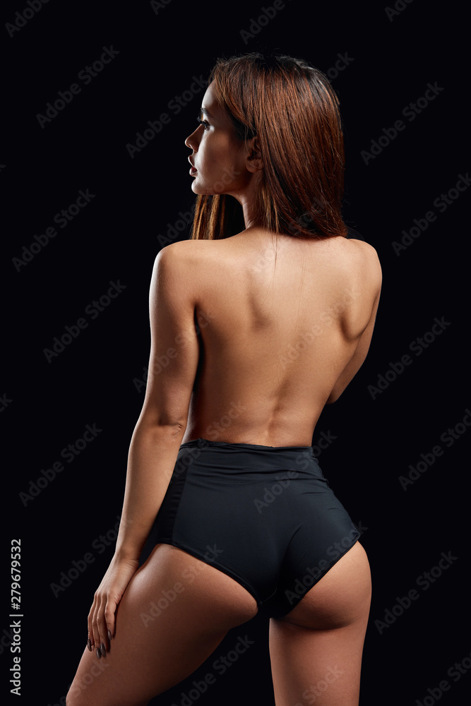 ass of a sexy slim girl in black underwear, back view photo. isolated black background, beauty concept. and body care foto de Stock | Adobe Stock