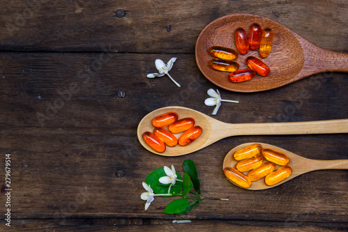 Omega 3 fish oil capsules  for good brain , heart and health. place on old  wooden plat.