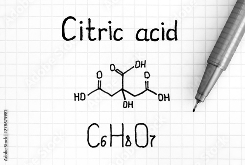Fotografie Chemical formula of Citric Acid with pen.