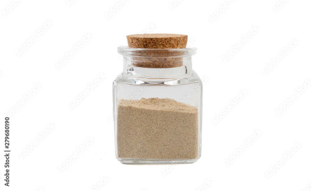 cardamon powder in glass jar on isolated on white background. front view. spices and food ingredients. cardamon powder in glass jar on isolated on white background. front view. spices and food ingredients.