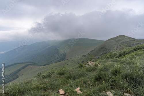 Fototapeta Naklejka Na Ścianę i Meble -  Mountain range in clouds in Bieszczady, Poland.