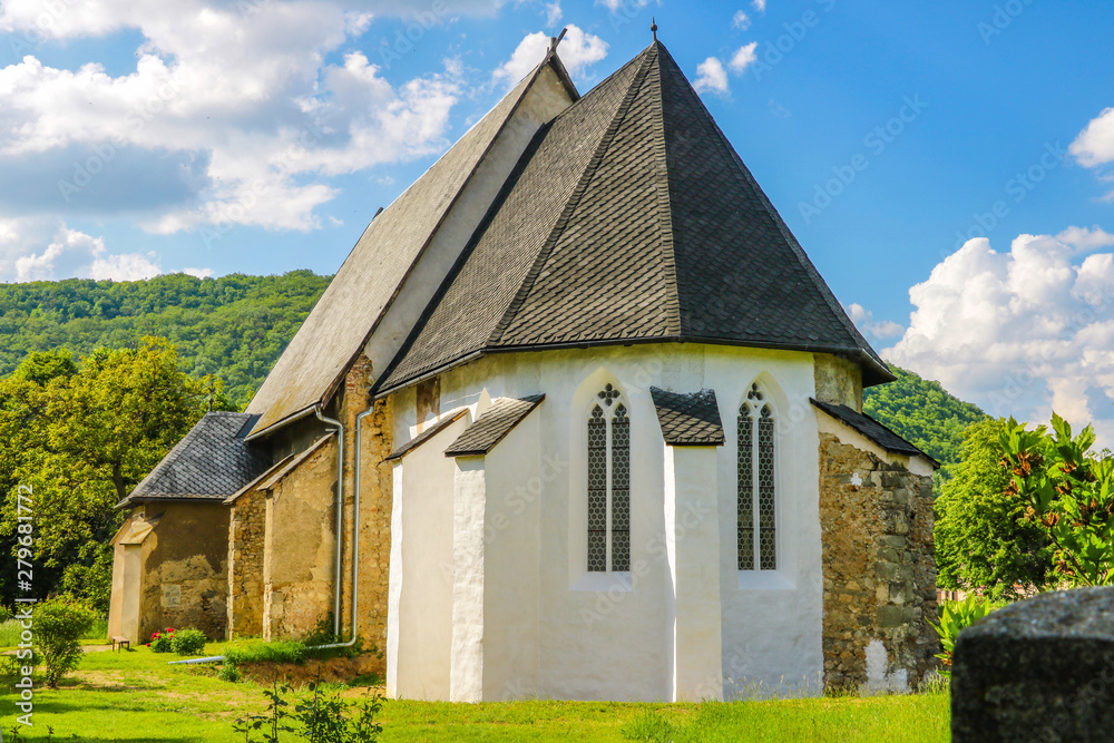 A small church in the mountains on a sunny day in Slovakia.
