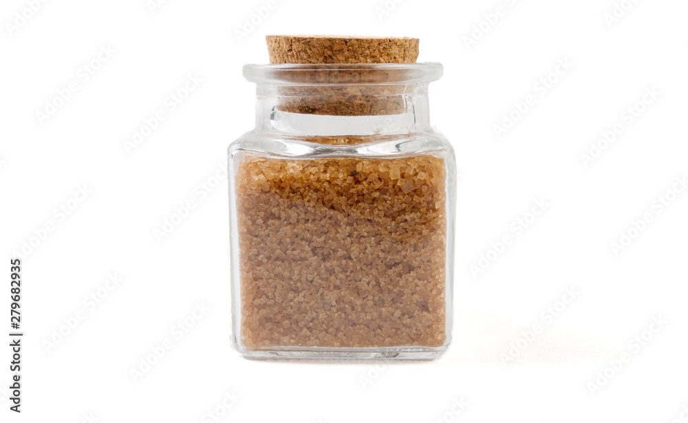 Brown or cane sugar in glass jar on isolated on white background. front view. spices and food ingredients. Brown or cane sugar in glass jar on isolated on white background. front view. spices and food ingredients.