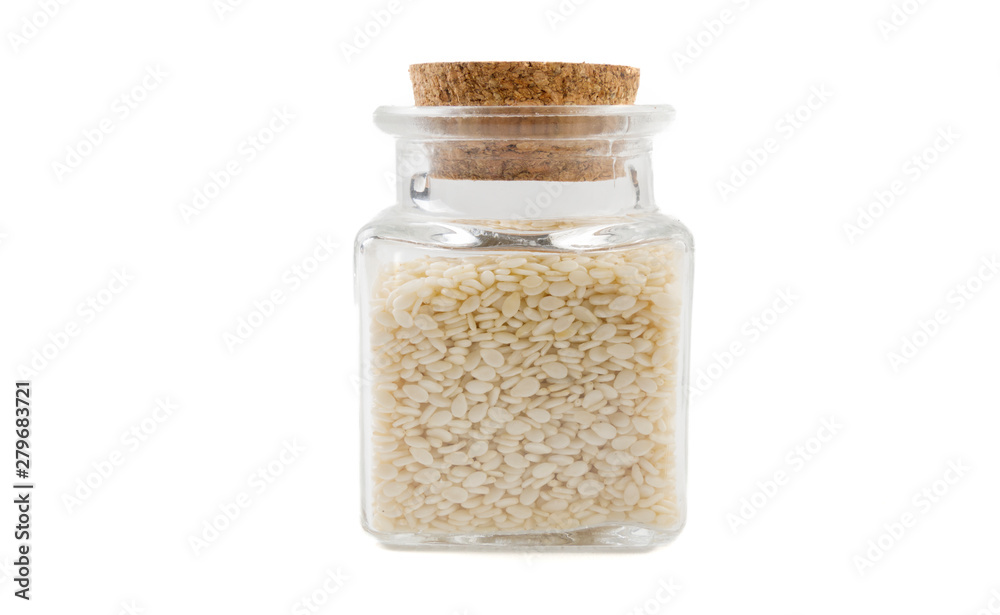 sesame seeds in glass jar on isolated on white background. front view. spices and food ingredients. sesame seeds in glass jar on isolated on white background. front view. spices and food ingredients.