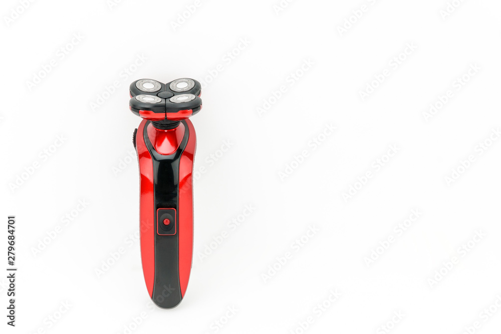 Electrical red shaver, haircut on the white mat background Electrical red shaver, haircut on the white mat background