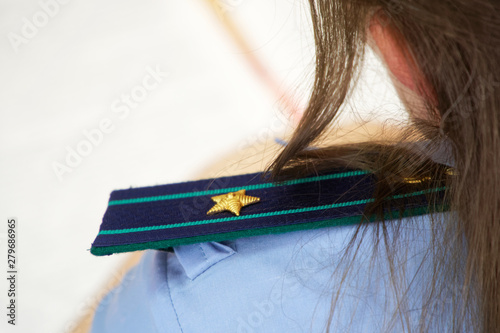 Shoulder straps in the Russian prosecutor's office. The girl is a junior counselor of justice. Ranks and titles in law enforcement photo