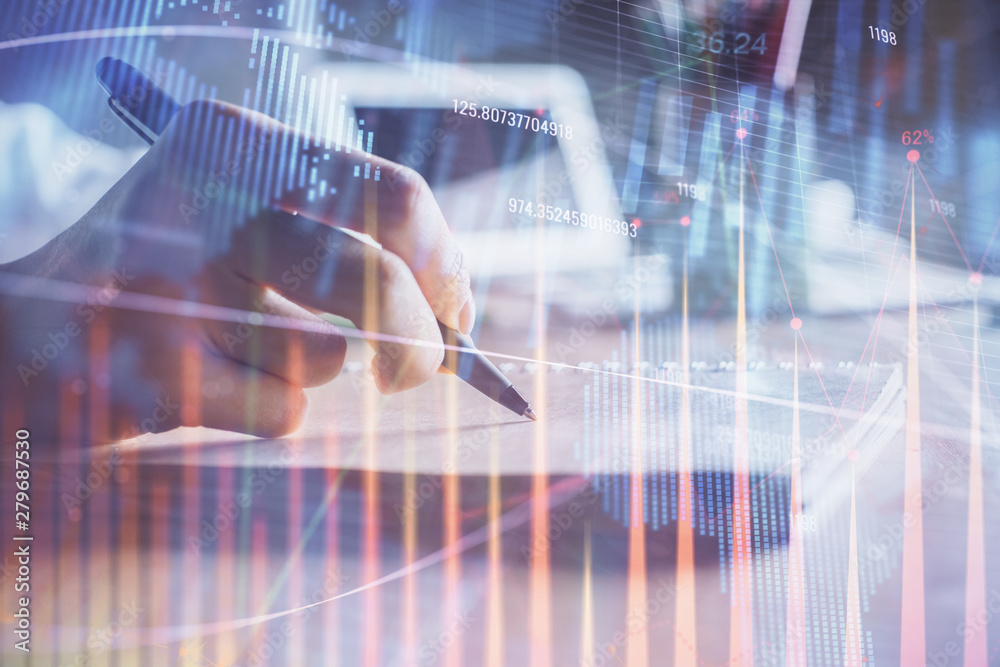 Financial charts displayed on woman's hand taking notes background. Concept of research. Double exposure Financial charts displayed on woman's hand taking notes background. Concept of research. Double exposure