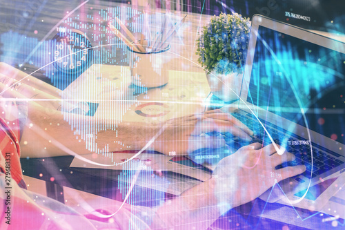 Wallpaper Mural Double exposure of businessman working on laptop on background. International business hologram in front. Concept of success. Torontodigital.ca