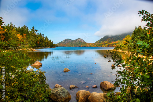 Early morning panoramic view of the fog, water and autumn colors of Long Pond in Acadia National Park photo