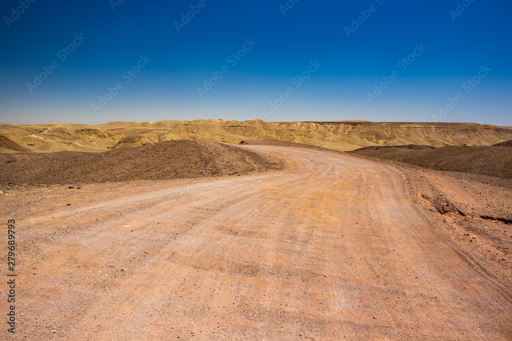 desert trail country side off road location with sand valley around and mountain background in Middle East hot natural environment desert trail country side off road location with sand valley around and mountain background in Middle East hot natural environment