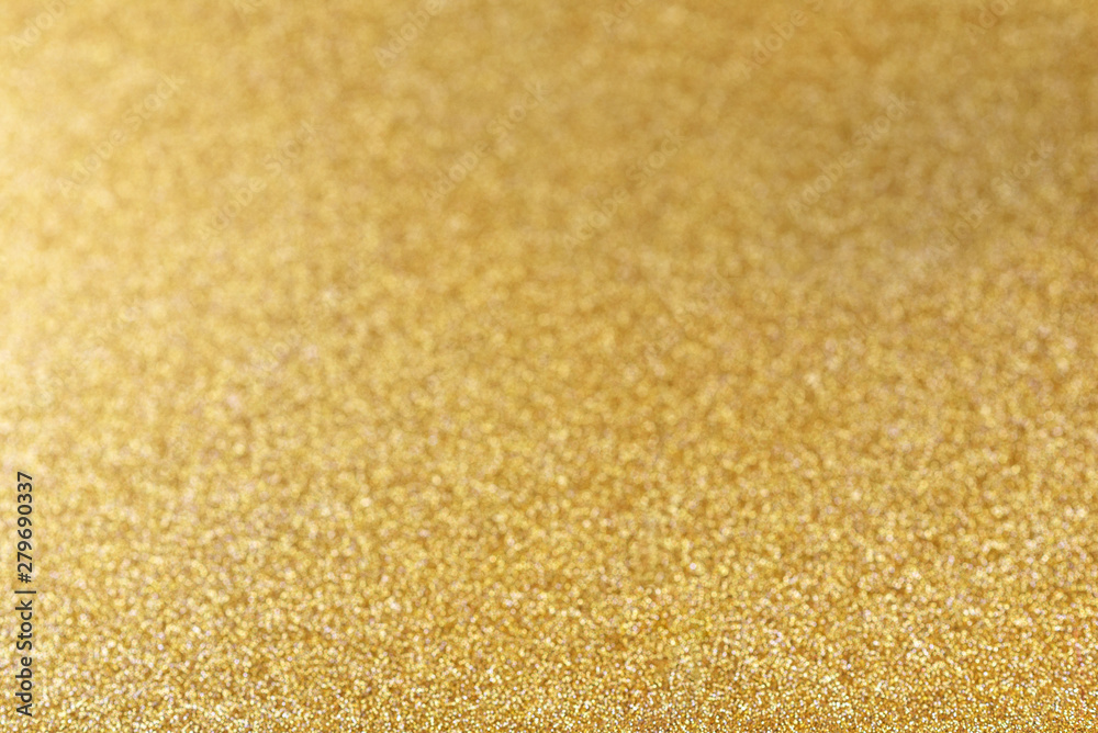 Gold festive glitter background with bokeh defocused golden lights. Gold festive glitter background with bokeh defocused golden lights.