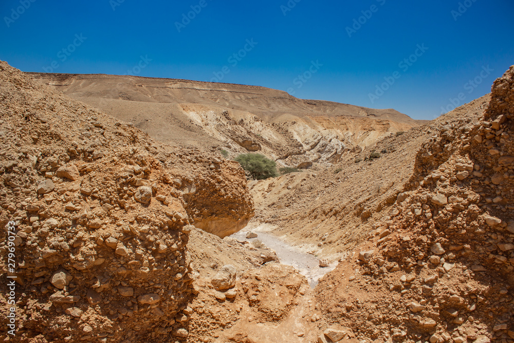 hot canyon rocks and sand wilderness scenery landscape environment place far from civilization in Judean desert in Israel 
