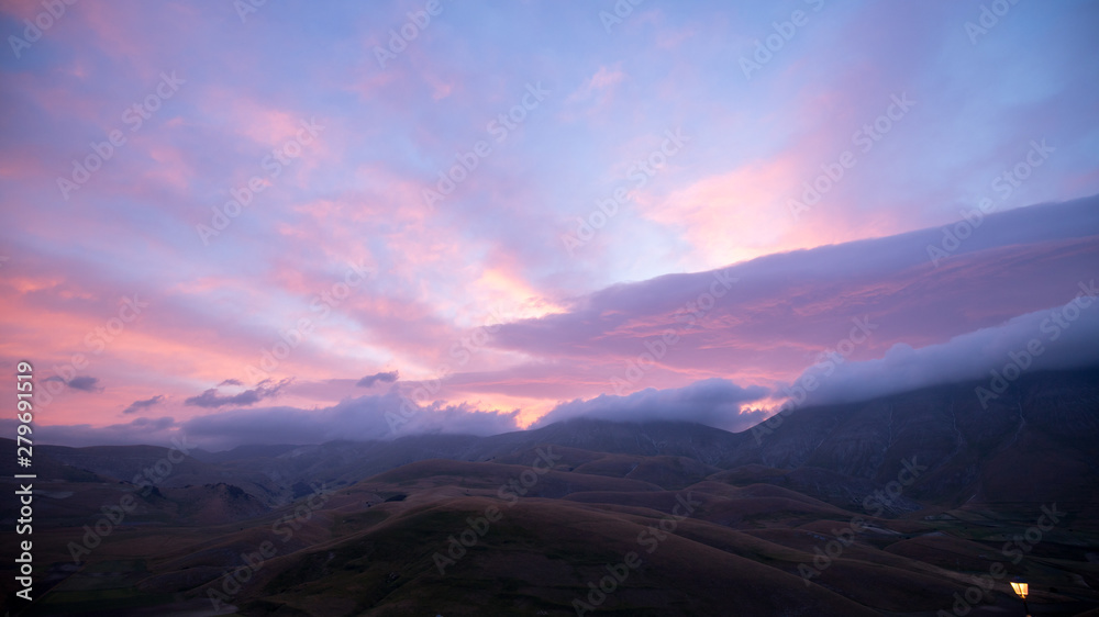 Sunrise in the natural landscape of the plain of Castelluccio di Norcia. Apennines, Umbria, Italy