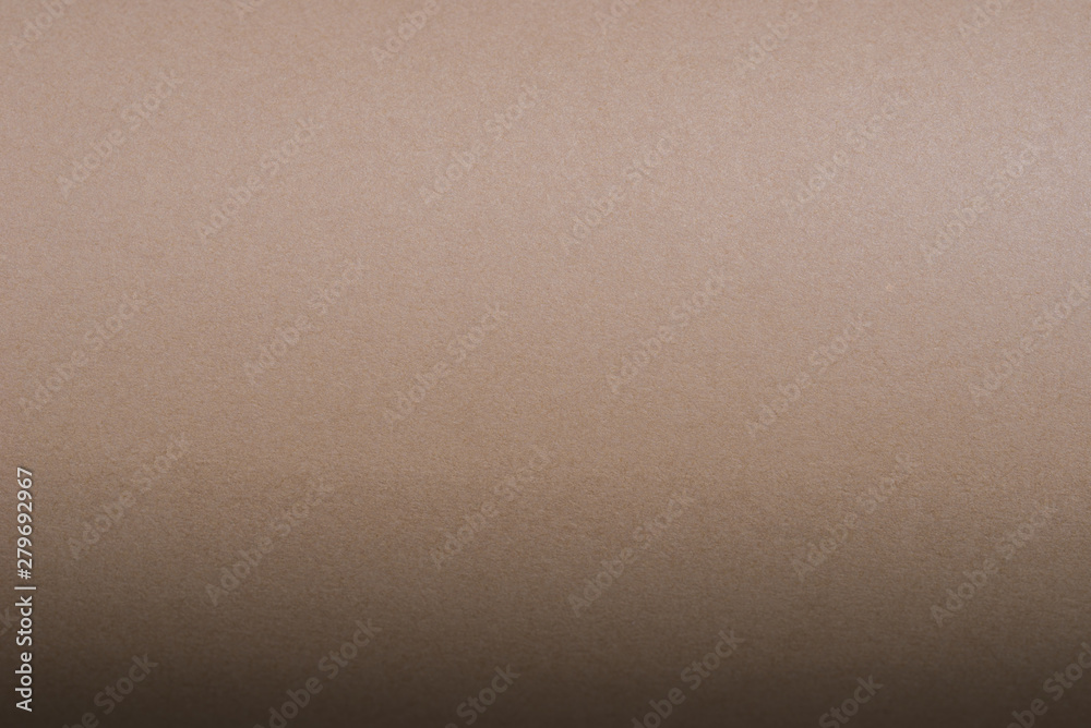 brown roller made with curved sheets of paper background texture
