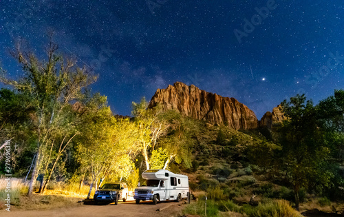 RV Camping under stars at night in Capitol Reef National Park, Utah, USA