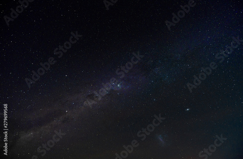 Fototapeta Naklejka Na Ścianę i Meble -  Cloudless starlit night sky with Milky Way and bright stars as panorama view for wallpaper and copy space
