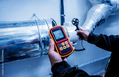 Bild auf Leinwand Technician use hand-held anemometer measuring air flowing measurement, wind speed and pressure