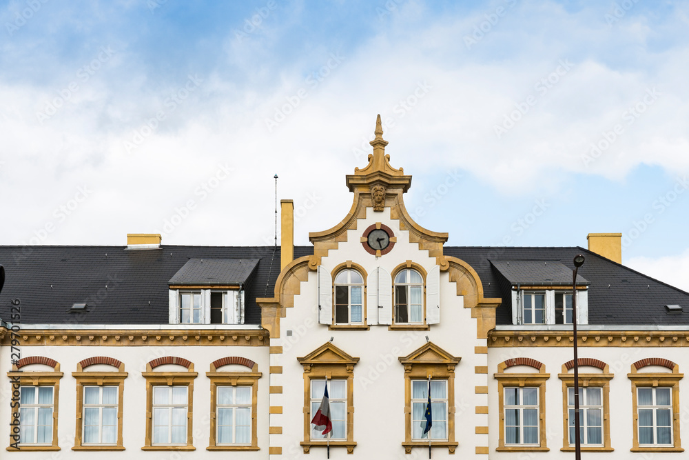 facade of old white school in Thionville, France