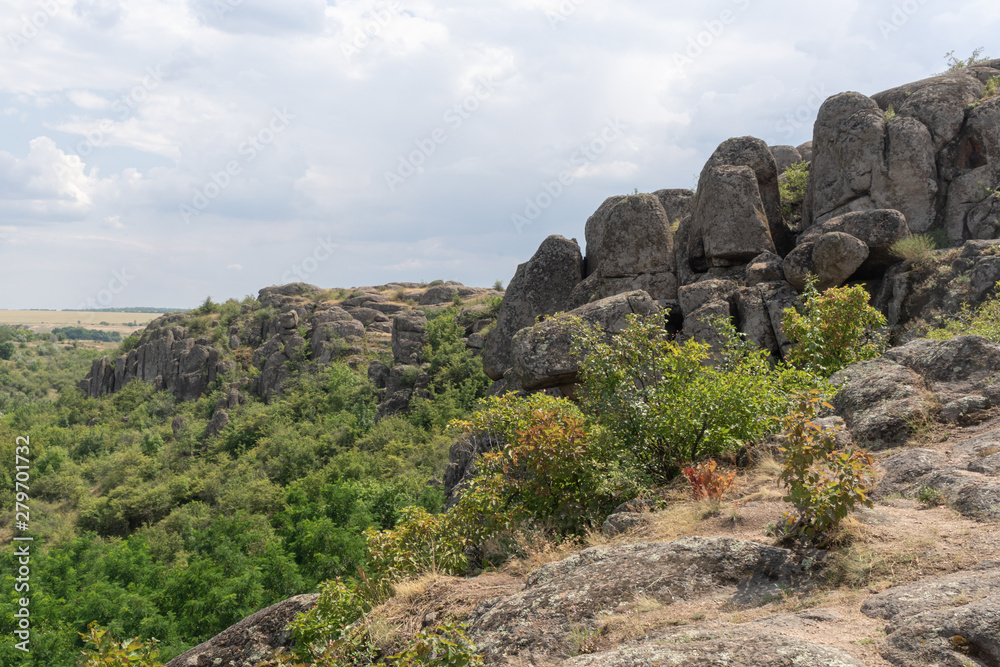 Large granite canyon. Village Aktove. Ukraine. Beautiful stone landscape.