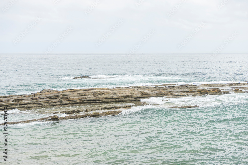 artificial concrete breakwater on the beaches of Santander, Cantabrian Sea, Spain