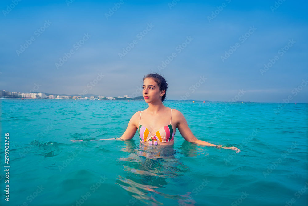 Young woman girl bath in the Ibiza beach