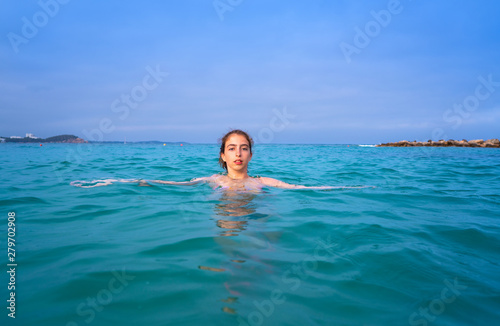 Young woman girl bath in the Ibiza beach © lunamarina