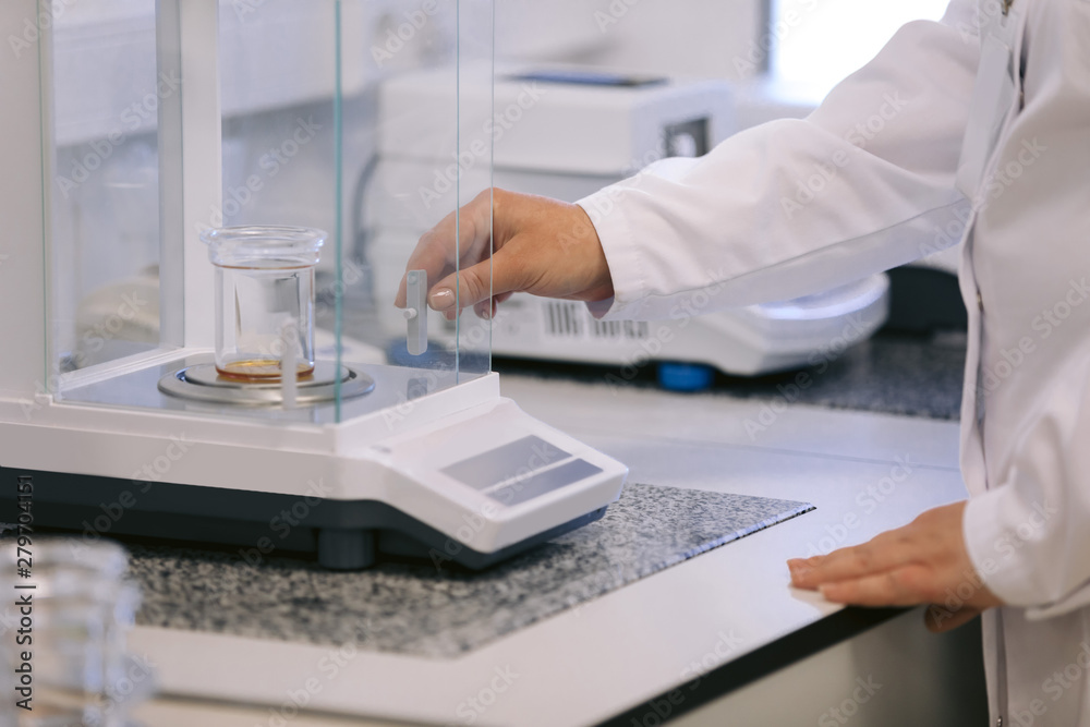Scientist holding a test tubes, Laboratory research. Scientist with test tube making research in clinical laboratory. Scientist holding a test tubes, Laboratory research. Scientist with test tube making research in clinical laboratory.