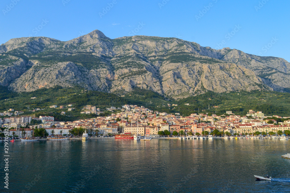  View of Makarska city center from the sea in Makarska,  Dalmatia, Croatia on June 11, 2019. 