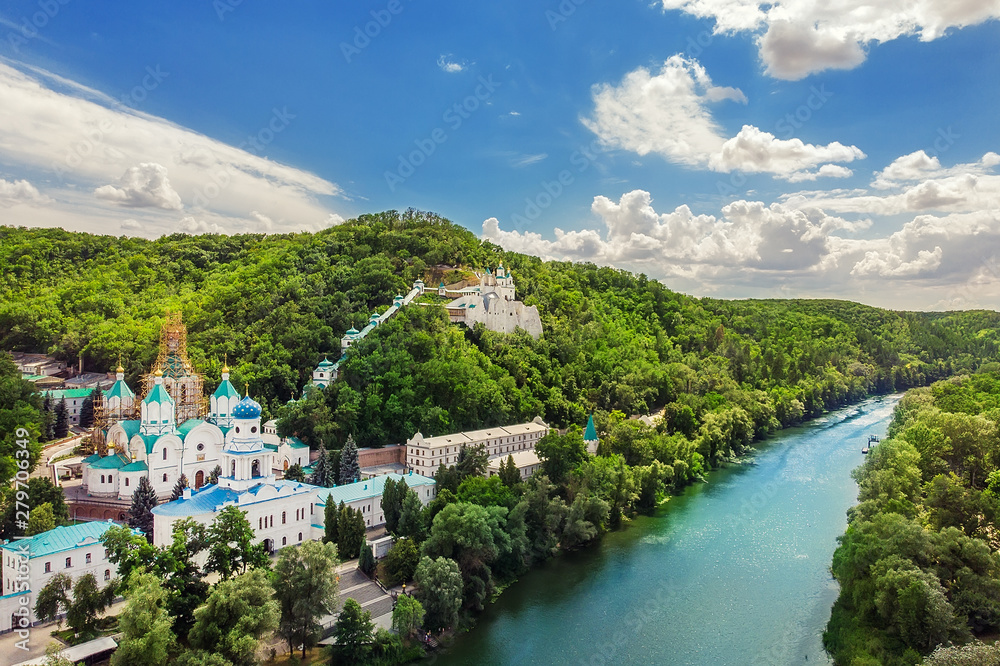 Svaytogorsk lavra ancient monastery hills panoramic view with green forest and Donets river at Donbass, Ukraine on bright sunny day. Ukraine travel destination place. Ukrainian tourism