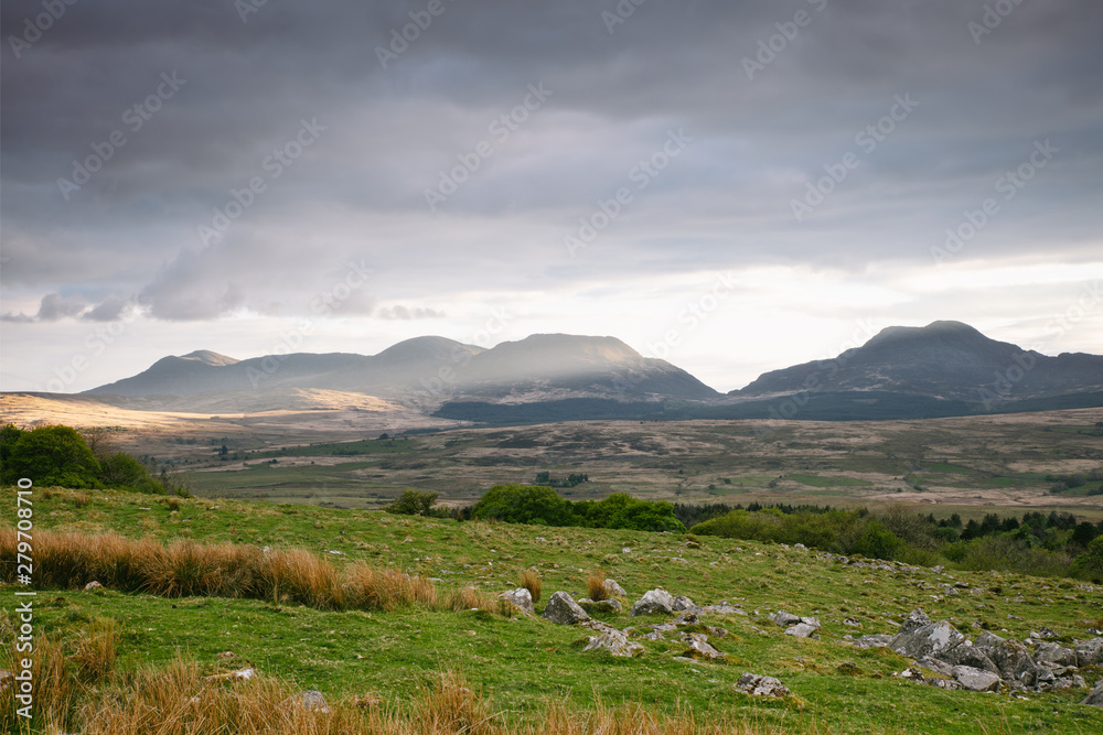 Stunning Landscape at sunset Image Panorama View Of Mountain Ranges In Snowdonia National Park In Wales, UK