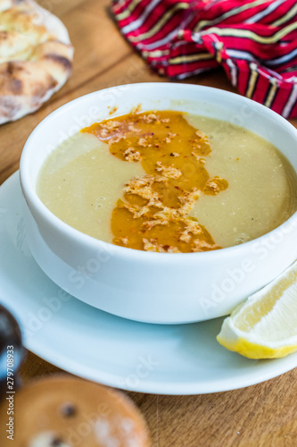 Turkish Lentil Soup with fried butter sauce / Mercimek Corbasi at Restaurant.