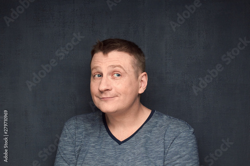 Fotografi Portrait of genial young man dreaming about something pleasant