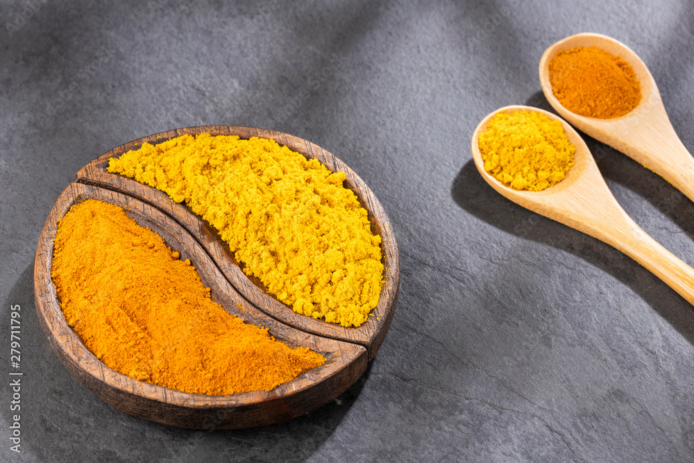 Turmeric and curry powder - Top view Turmeric and curry powder - Top view