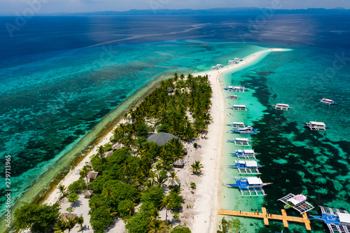 Aerial view of traditional boats moored off a tiny tropical island in the Philippines (Kalanggaman) photo