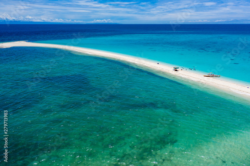 Aerial view of a tiny offshore sandbar and tropical coral reef (White Island)