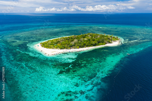 Aerial view of tropical Mantigue island off the coast of Camiguin in the Philippines