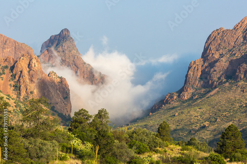 Clouds passing over 'The Window' in the Chisos Basin during the day in Big Bend National Park (Texas). photo