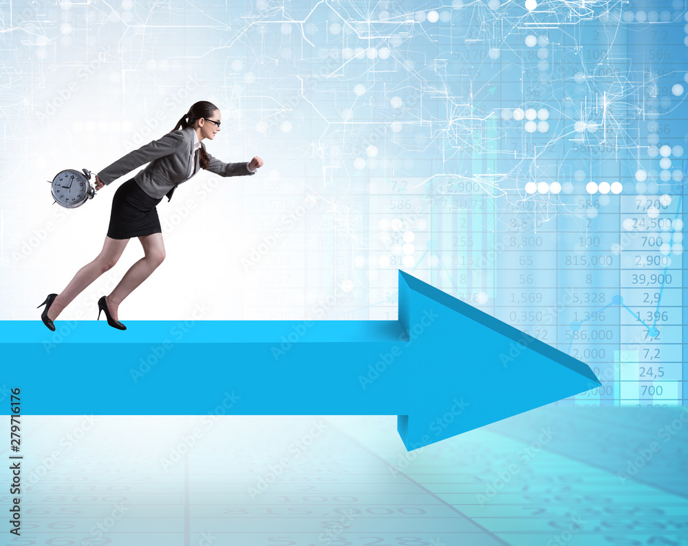 Businesswoman walking on arrow sign Businesswoman walking on arrow sign