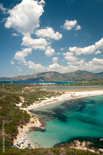 Sardinia, Villasimius. Panoramic view of Porto Giunco beach with turquoise sea water. Porto Giunco is also known as the beach of the two seas due to the presence of the Nottieri pond behind the beach