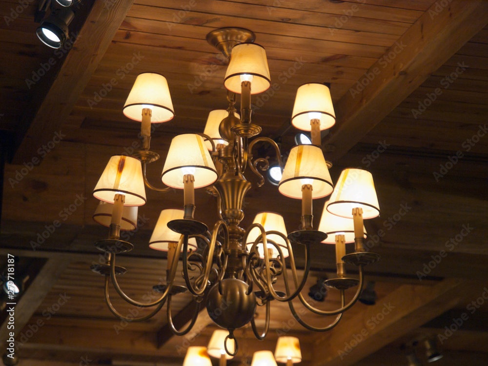 Romantic diner under an old rustic chandelier Romantic diner under an old rustic chandelier