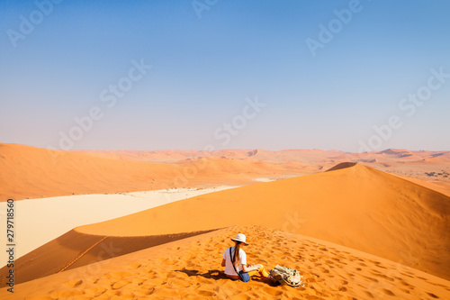 Little girl on red sand dune © BlueOrange Studio
