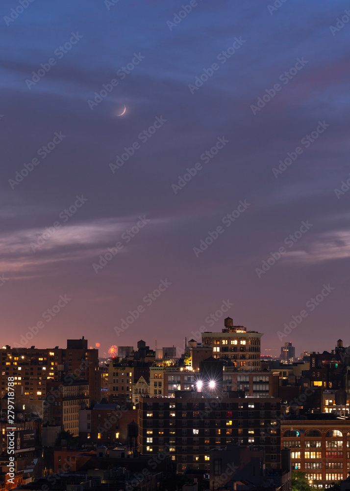 Aerial view of Downtown manhattan with crescent moon at night