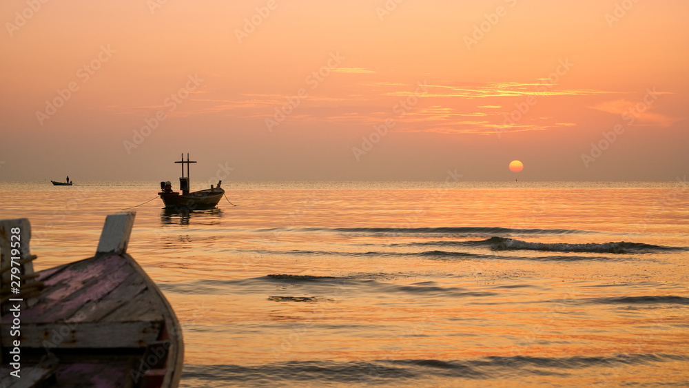 sunrise skyline and seascape with fisherman boat in morning