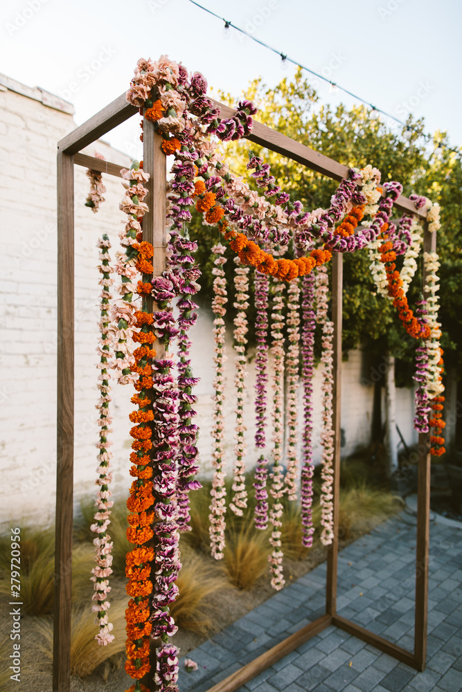 ceremony backdrop with hanging flowers
