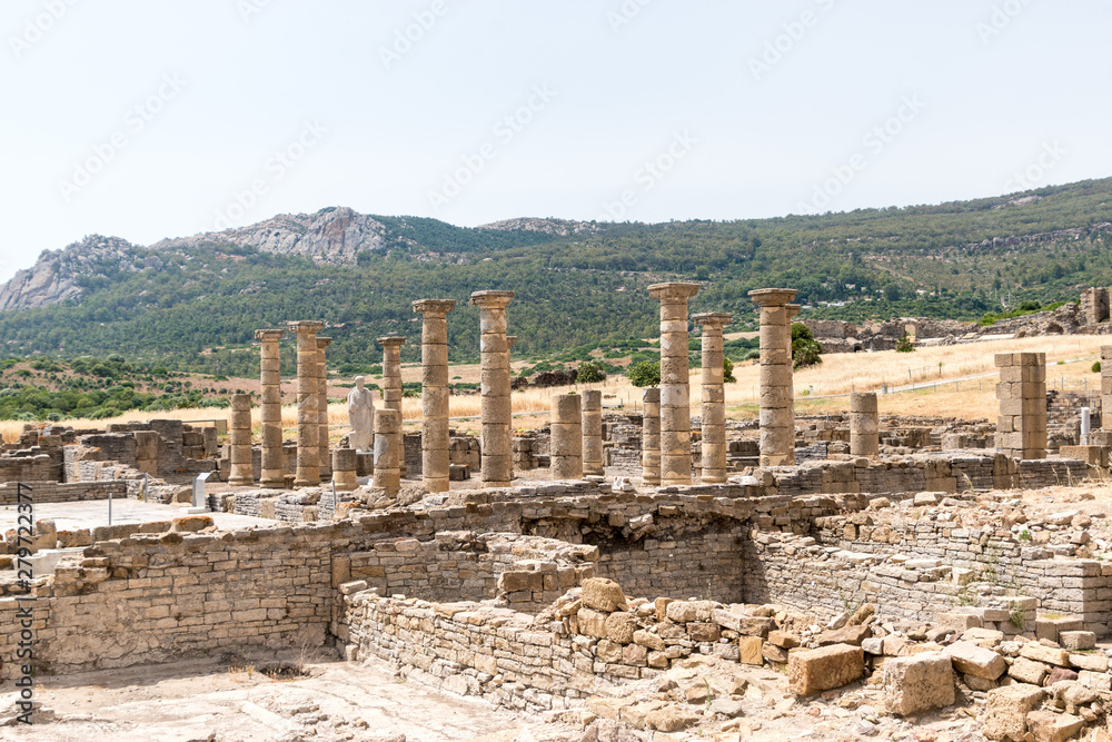 Columns and ruins from the basilica of Baelo Claudia, an ancient Roman town located on the shores of the Straight of Gibraltar near the village of Bolonia, Spain.